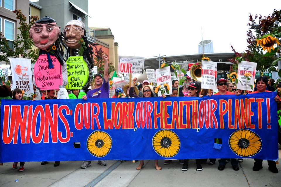 Union members and climate justice activists march together